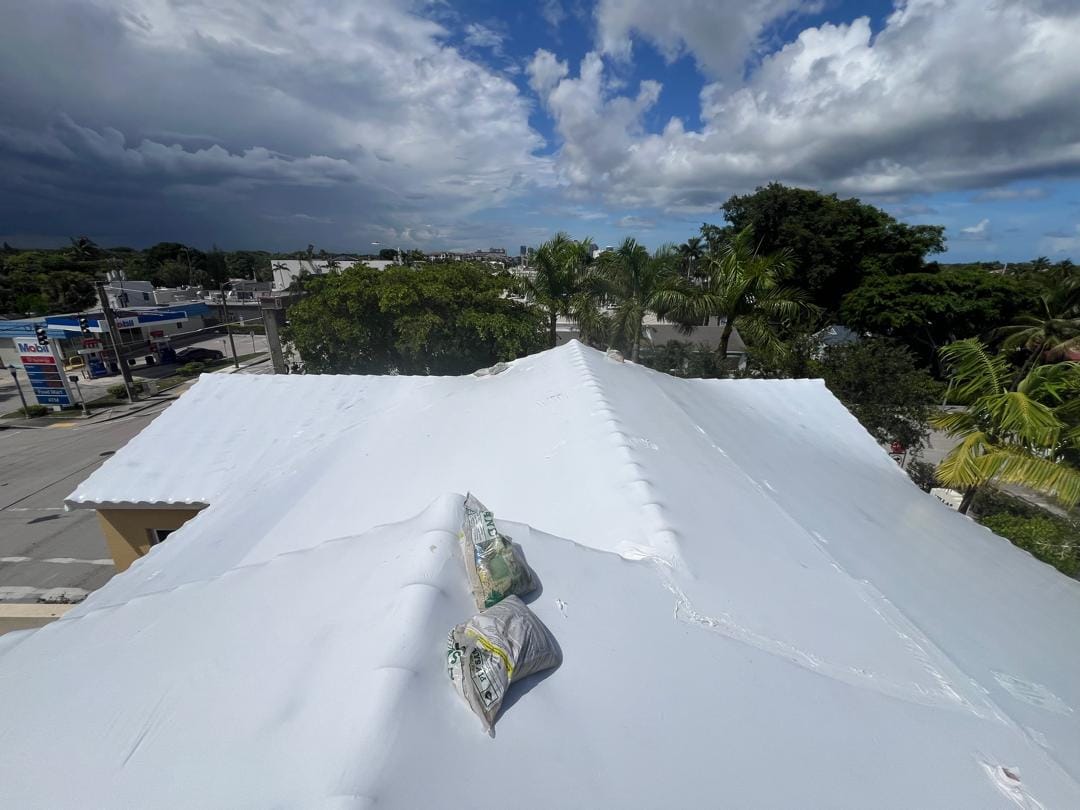 Freshly coated white roof seen from above with the full surface sealed